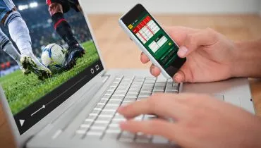 Imagem mostra uma pessoa apostando em um site de apostas esportivas.