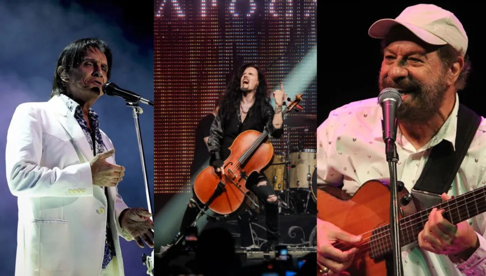 Fotografia em tríptico dividida verticalmente em três quadros, apresentando retratos de três artistas musicais em apresentações ao vivo. À esquerda, no primeiro quadro em plano médio, destaca-se o cantor Roberto Carlos apresentando-se em um palco. Homem de pele clara e cabelos escuros, ele canta em um microfone fixo em pedestal, vestindo elegante terno branco com camisa social estampada aberta na gola. Ao centro, no segundo quadro em plano médio, um violoncelista da banda Apocalyptica performa energeticamente no palco. Homem de cabelos longos e escuros, vestindo roupas pretas, ele toca seu violoncelo sob iluminação cênica e um painel de LED ao fundo. À direita, no terceiro quadro em plano médio, o cantor e compositor Almir Sater toca viola caipira enquanto canta em um microfone. Homem de pele clara, barba e bigode grisalhos, ele usa boné claro e camisa social branca com delicados detalhes estampados, sustentando o instrumento com uma correia preta. Ao fundo de cada quadro, a iluminação cênica e a atmosfera de show ao ar livre ou em casa de espetáculos compõem o ambiente de cada apresentação.