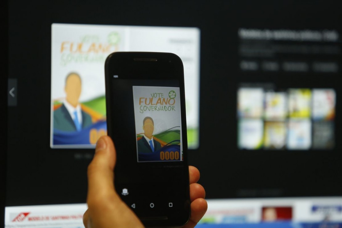 Aplicativo reconhece a fotografia em santinhos e passa a ficha corrida dos candidatos. Foto: Lineu Filho