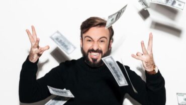 Portrait of a happy bearded man celebrating success