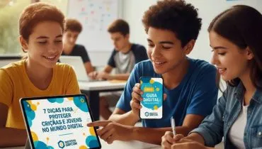 Imagem mostra jovens em uma escola com tablets e celulares nas mãos.